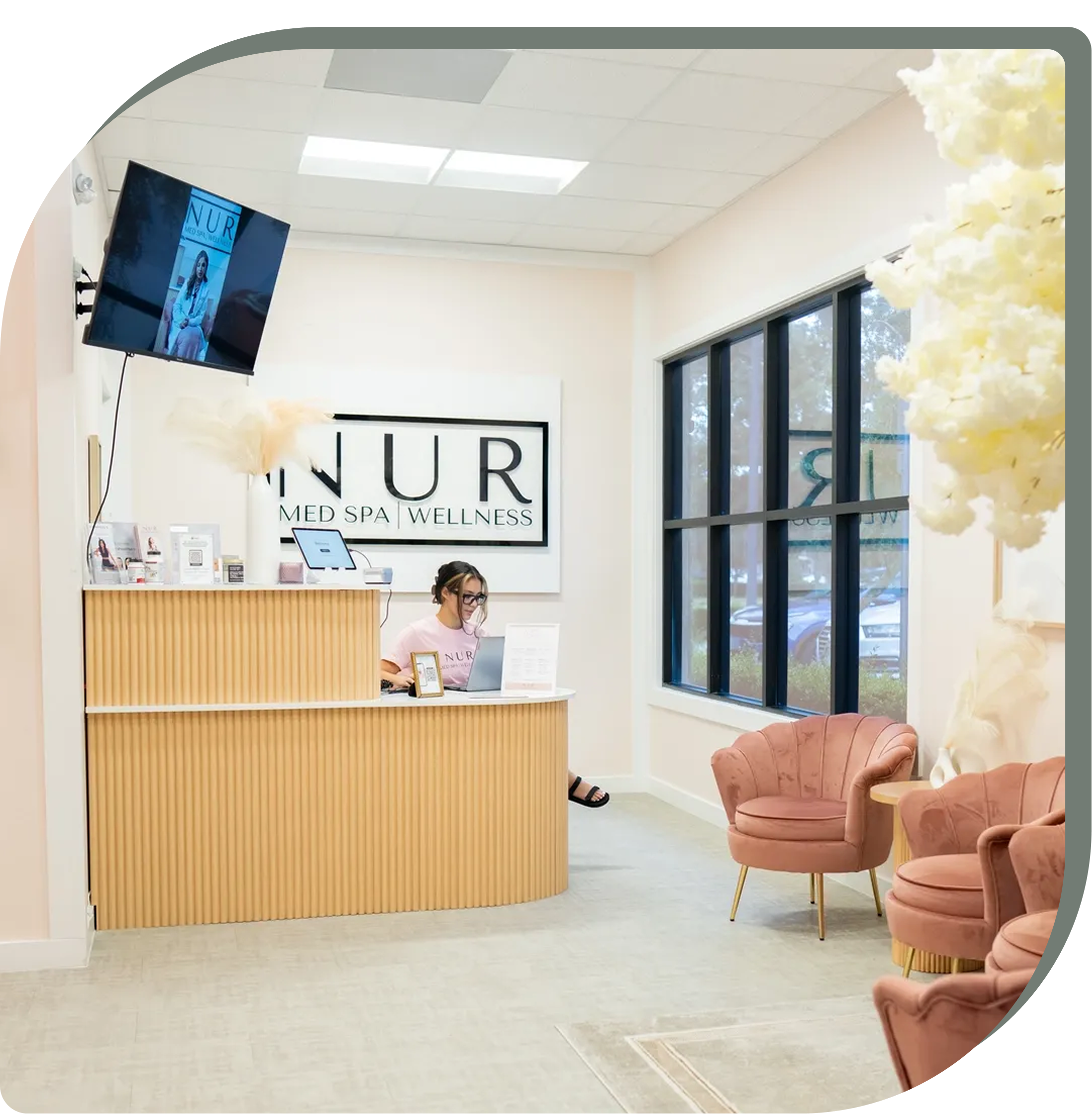 Aesthetician applying a facial mask to a client
